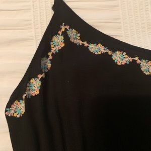 Black romper with embroidered detail